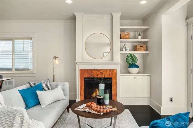a living room with furniture and a fireplace