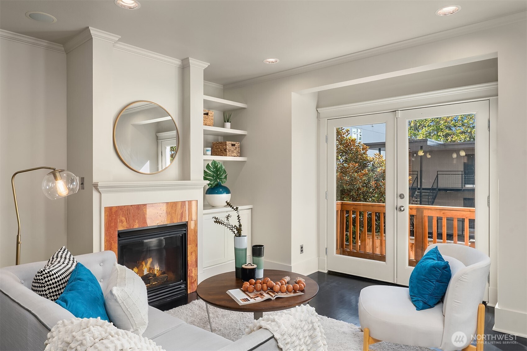 527 11th Avenue East, Unit A Seattle, WA 98102 - Photo 5 of 37 a living room with furniture a window and a fireplace