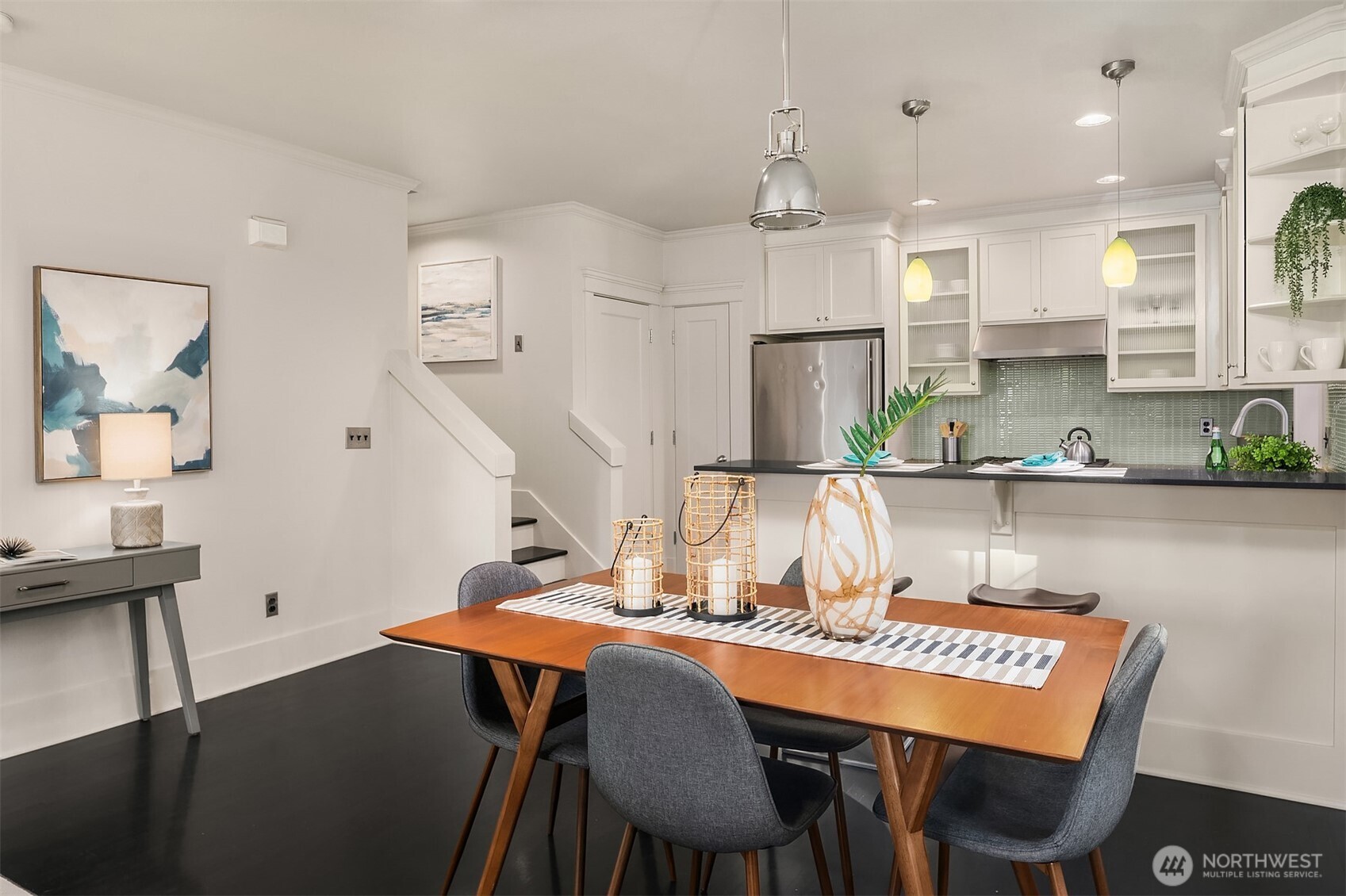 527 11th Avenue East, Unit A Seattle, WA 98102 - Photo 9 of 37 a view of a dining room with furniture and wooden floor