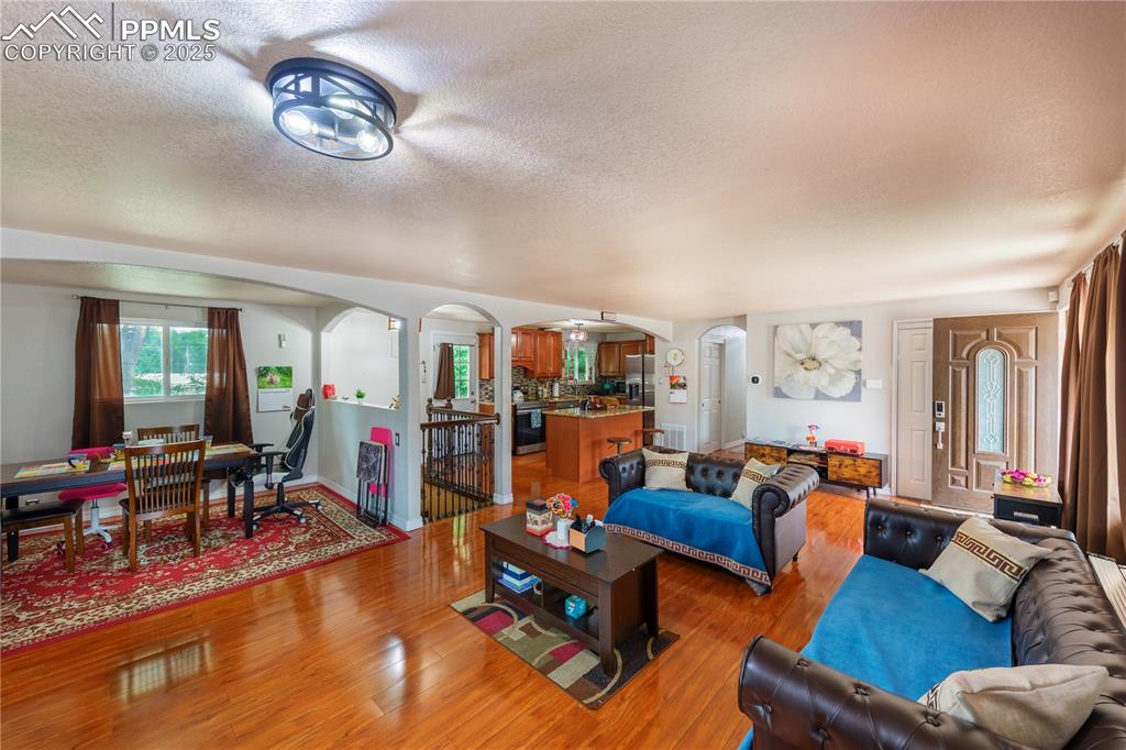 2205 Airport Road Colorado Springs, CO 80910 - Photo 15 of 40 a living room with furniture kitchen view and a large window