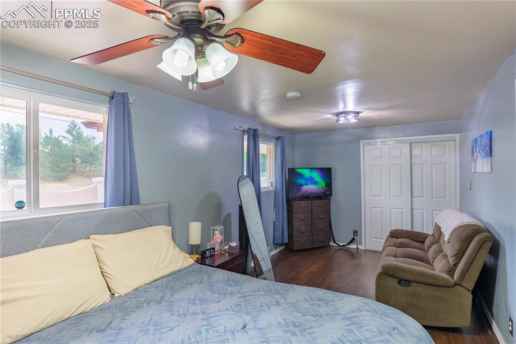 2205 Airport Road Colorado Springs, CO 80910 - Photo 19 of 40 a living room with furniture and a chandelier
