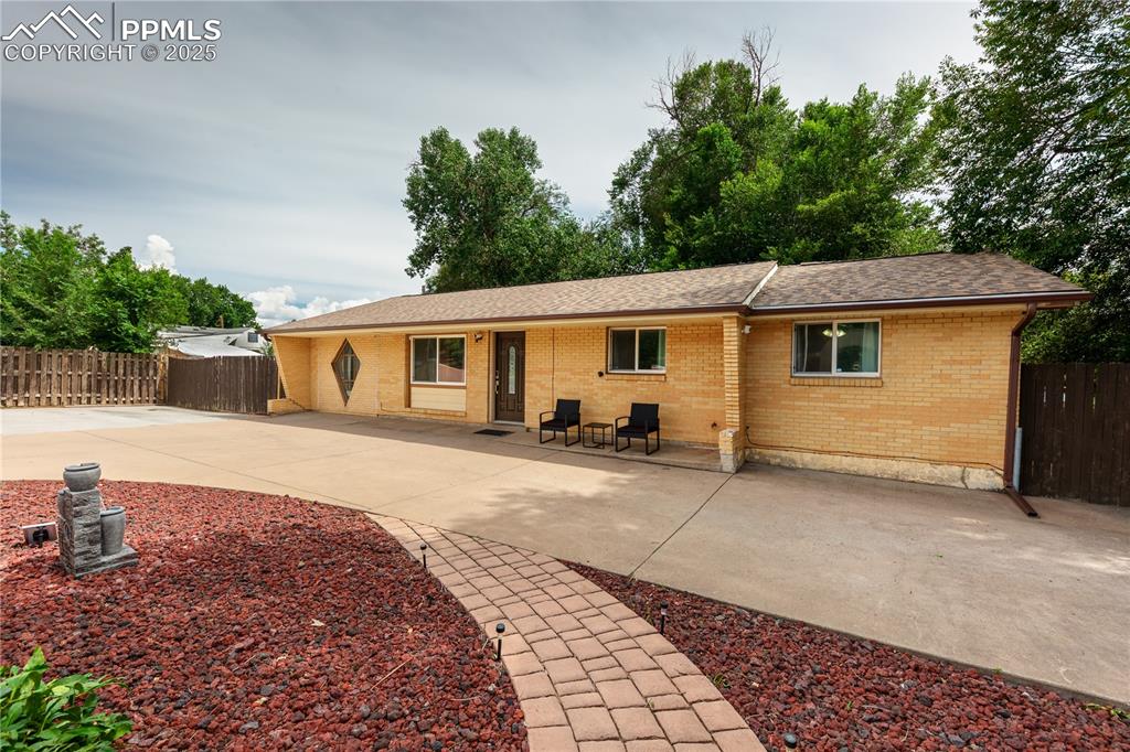 2205 Airport Road Colorado Springs, CO 80910 - Photo 2 of 40 a view of a house with backyard and sitting area