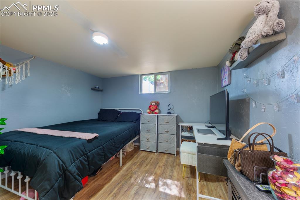 2205 Airport Road Colorado Springs, CO 80910 - Photo 28 of 40 a bed room with a bed and a fish tank