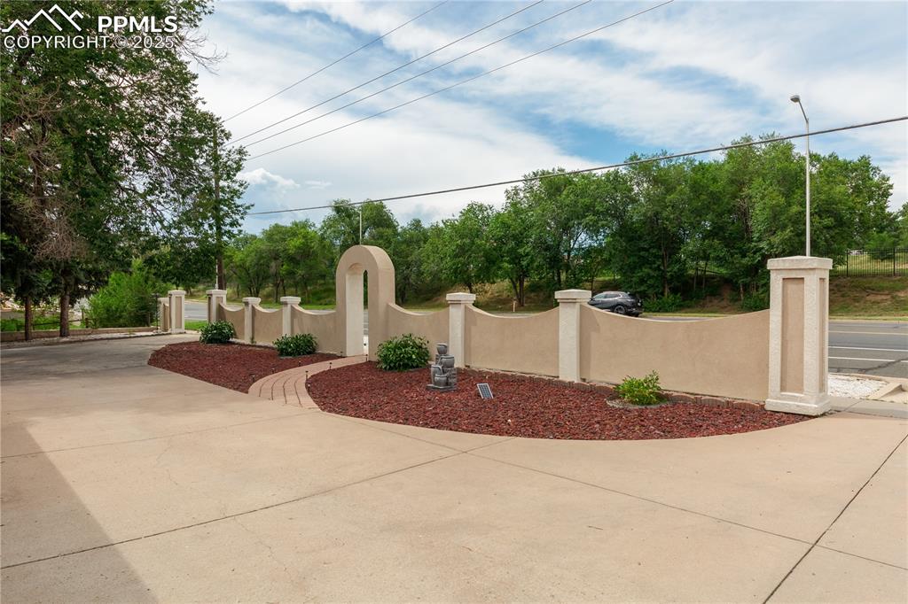 2205 Airport Road Colorado Springs, CO 80910 - Photo 3 of 40 a front view of a house with garden