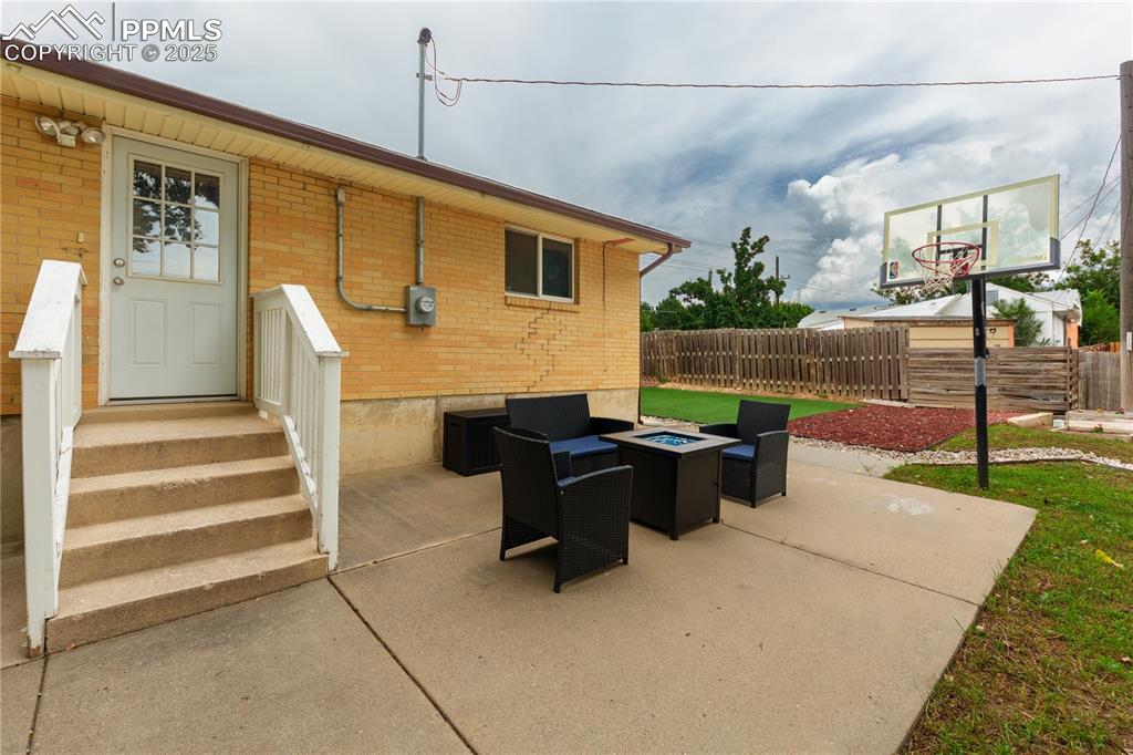 2205 Airport Road Colorado Springs, CO 80910 - Photo 33 of 40 a view of a patio with table and chairs