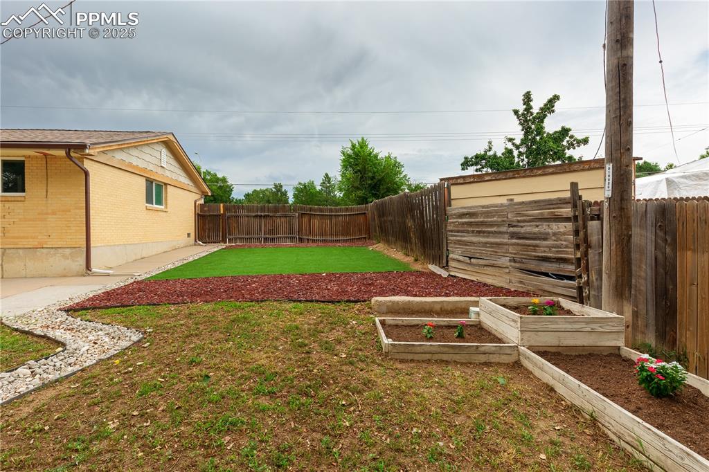 2205 Airport Road Colorado Springs, CO 80910 - Photo 36 of 40 a view of house with backyard and sitting area