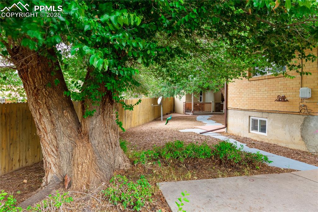 2205 Airport Road Colorado Springs, CO 80910 - Photo 38 of 40 a backyard of a house with lots of green space