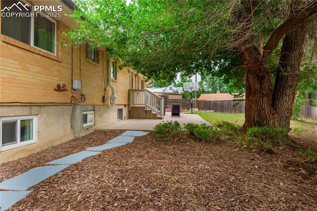 2205 Airport Road Colorado Springs, CO 80910 - Photo 40 of 40 a front view of a house with garden