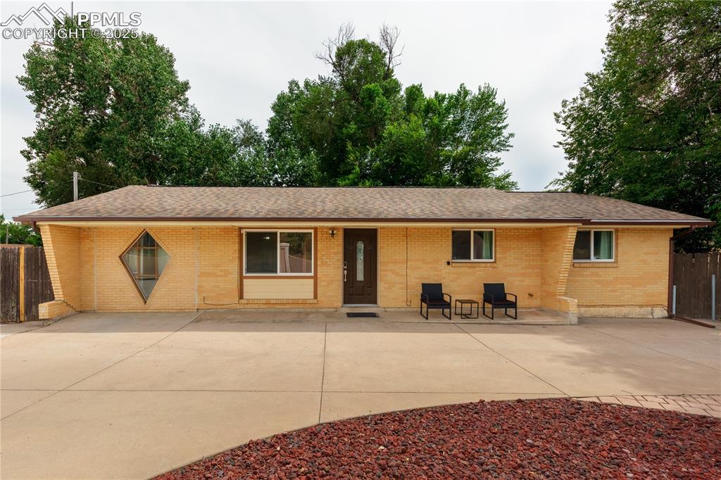 2205 Airport Road Colorado Springs, CO 80910 - Photo 6 of 40 a view of a house with backyard and sitting area