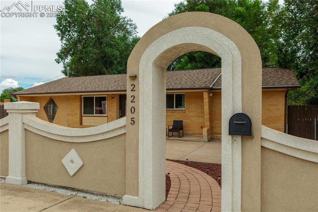 2205 Airport Road Colorado Springs, CO 80910 - Photo 8 of 40 a front view of a house with garden