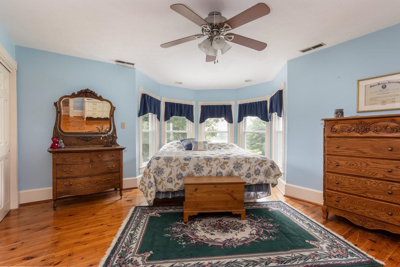 7231 Spring Creek Road Bridgewater, VA 22812 - Photo 28 of 74 a bedroom with a bed and wooden floor