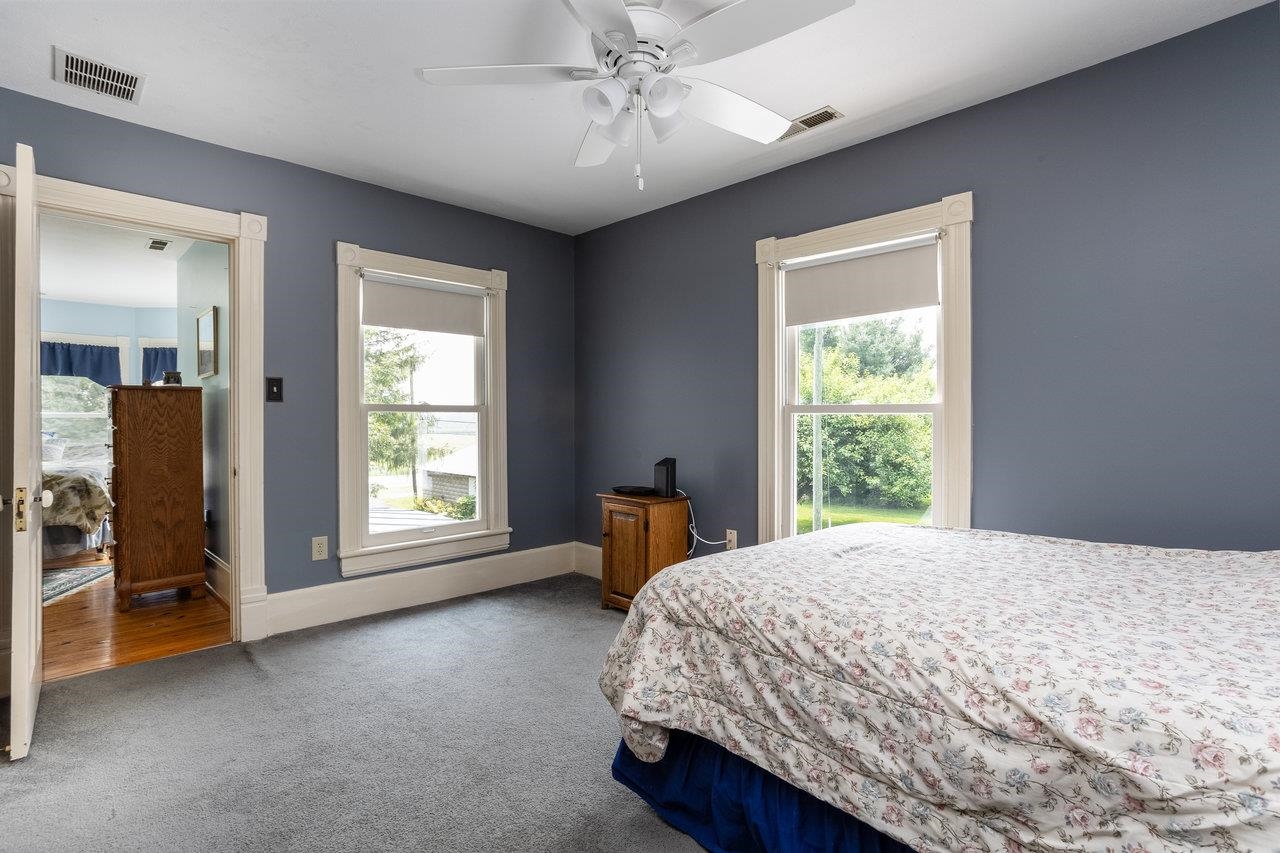 7231 Spring Creek Road Bridgewater, VA 22812 - Photo 34 of 74 a bedroom with a bed dresser and a window