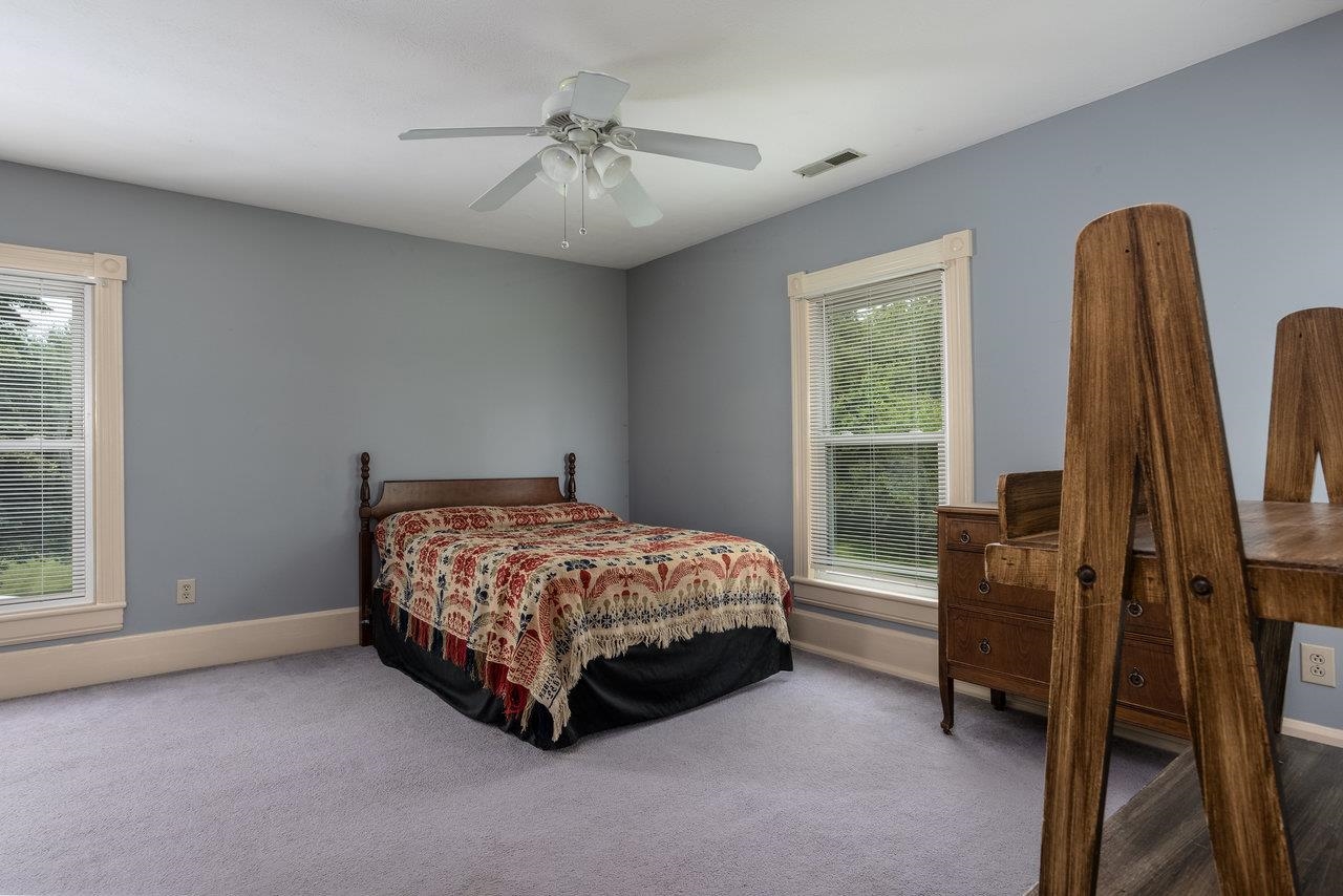 7231 Spring Creek Road Bridgewater, VA 22812 - Photo 37 of 74 a bed sitting in a room next to a window