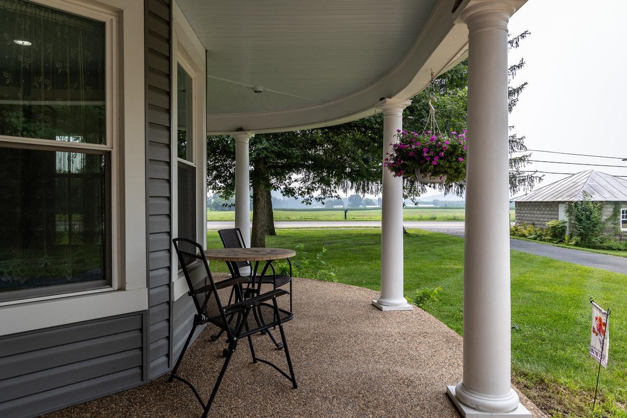 7231 Spring Creek Road Bridgewater, VA 22812 - Photo 42 of 74 a view of a porch with chairs and backyard