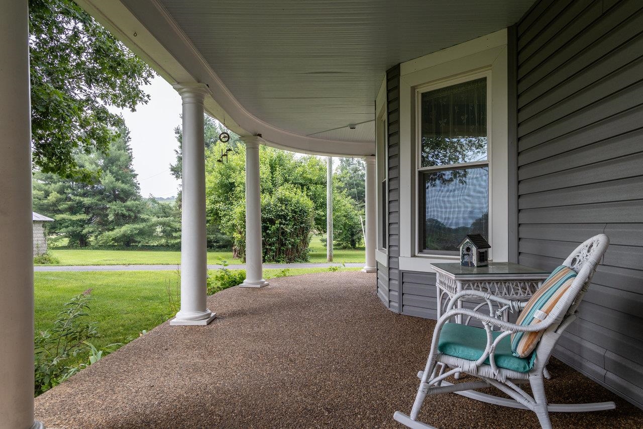 7231 Spring Creek Road Bridgewater, VA 22812 - Photo 44 of 74 a view of a chair and table in backyard of the house