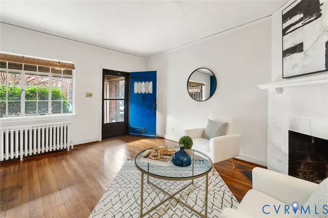 a view of a livingroom with furniture and wooden floor
