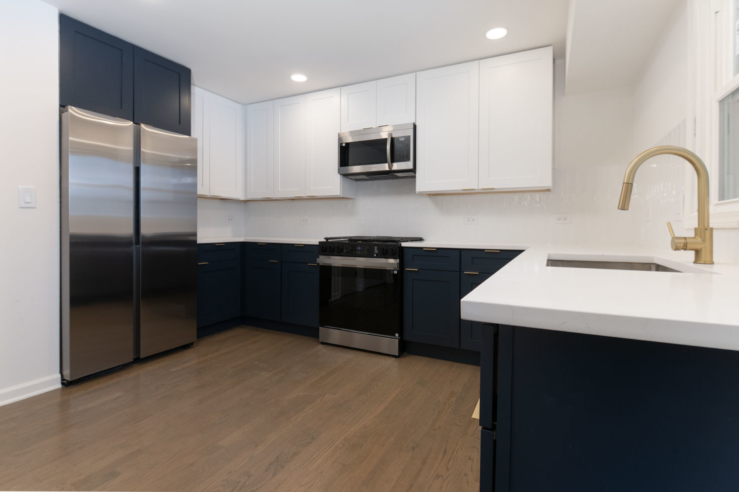 3712 Beech Street Flossmoor, IL 60422 - Photo 9 of 35 a kitchen with stainless steel appliances a sink a stove a microwave a refrigerator a sink and cabinets