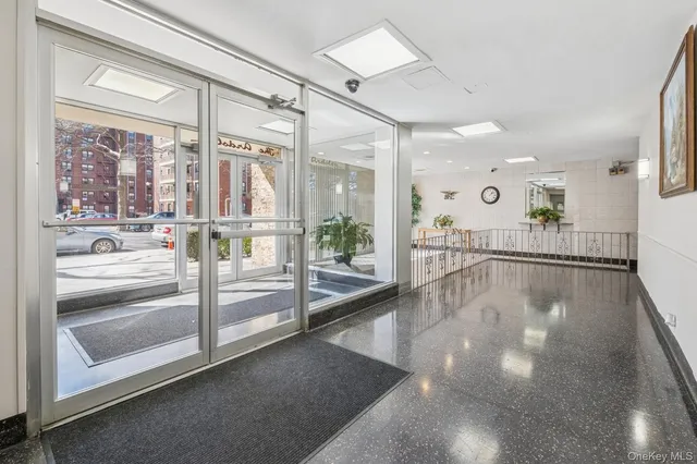 a view of a living room and chandelier