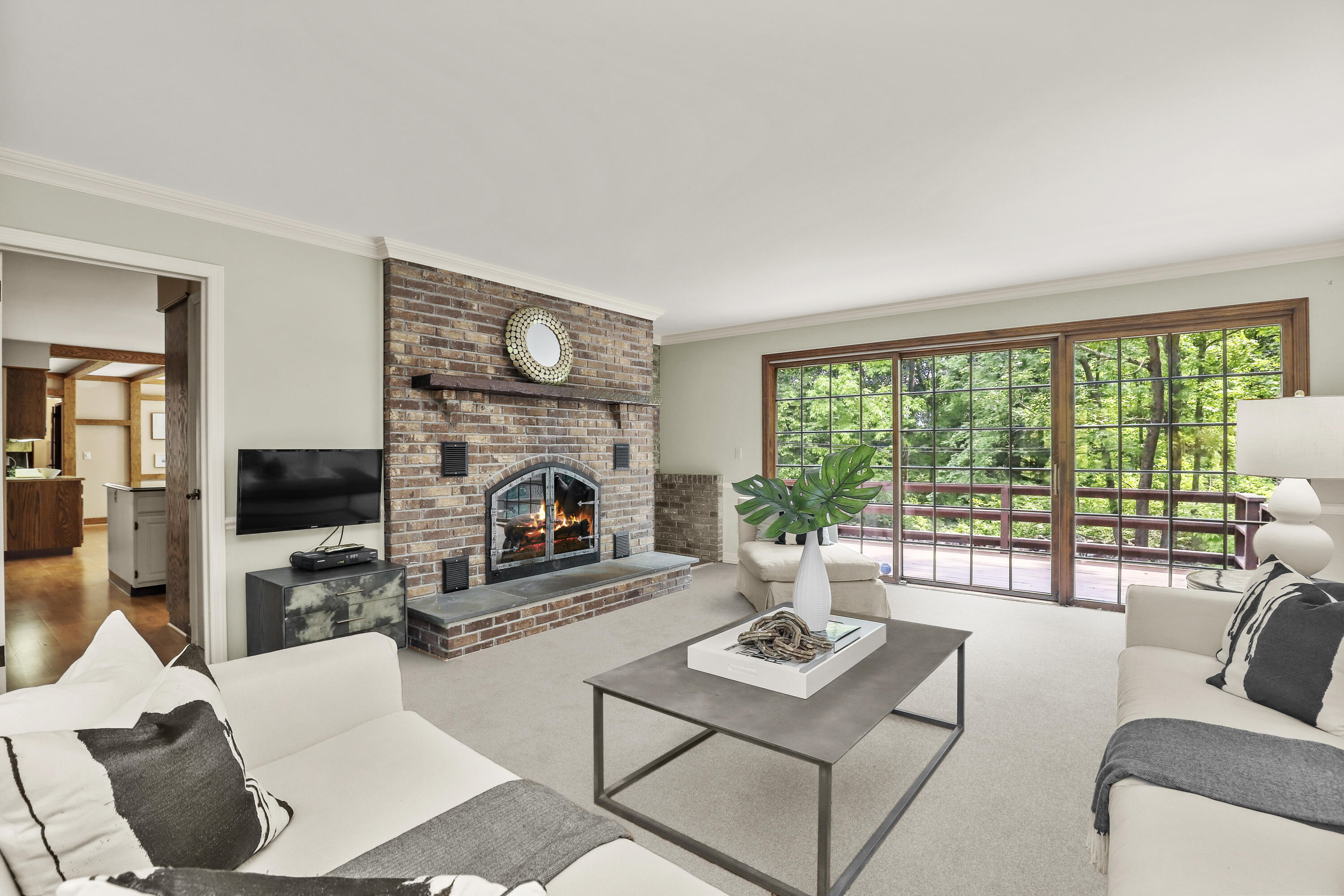37 Long Lots Road New Canaan, CT 06840 - Photo 20 of 42 a living room with furniture a fireplace and a floor to ceiling window