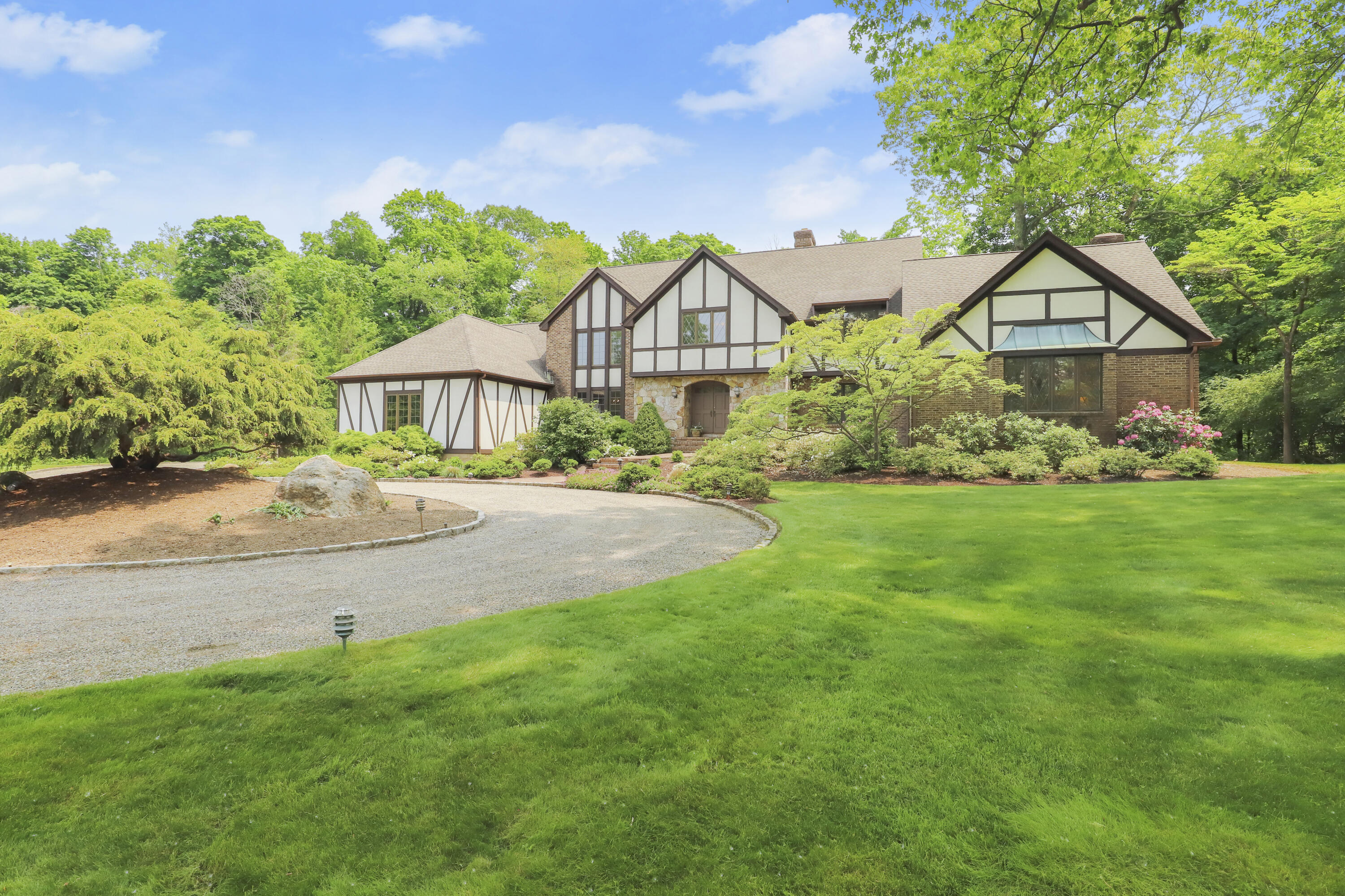 37 Long Lots Road New Canaan, CT 06840 - Photo 6 of 42 a front view of a house with a yard