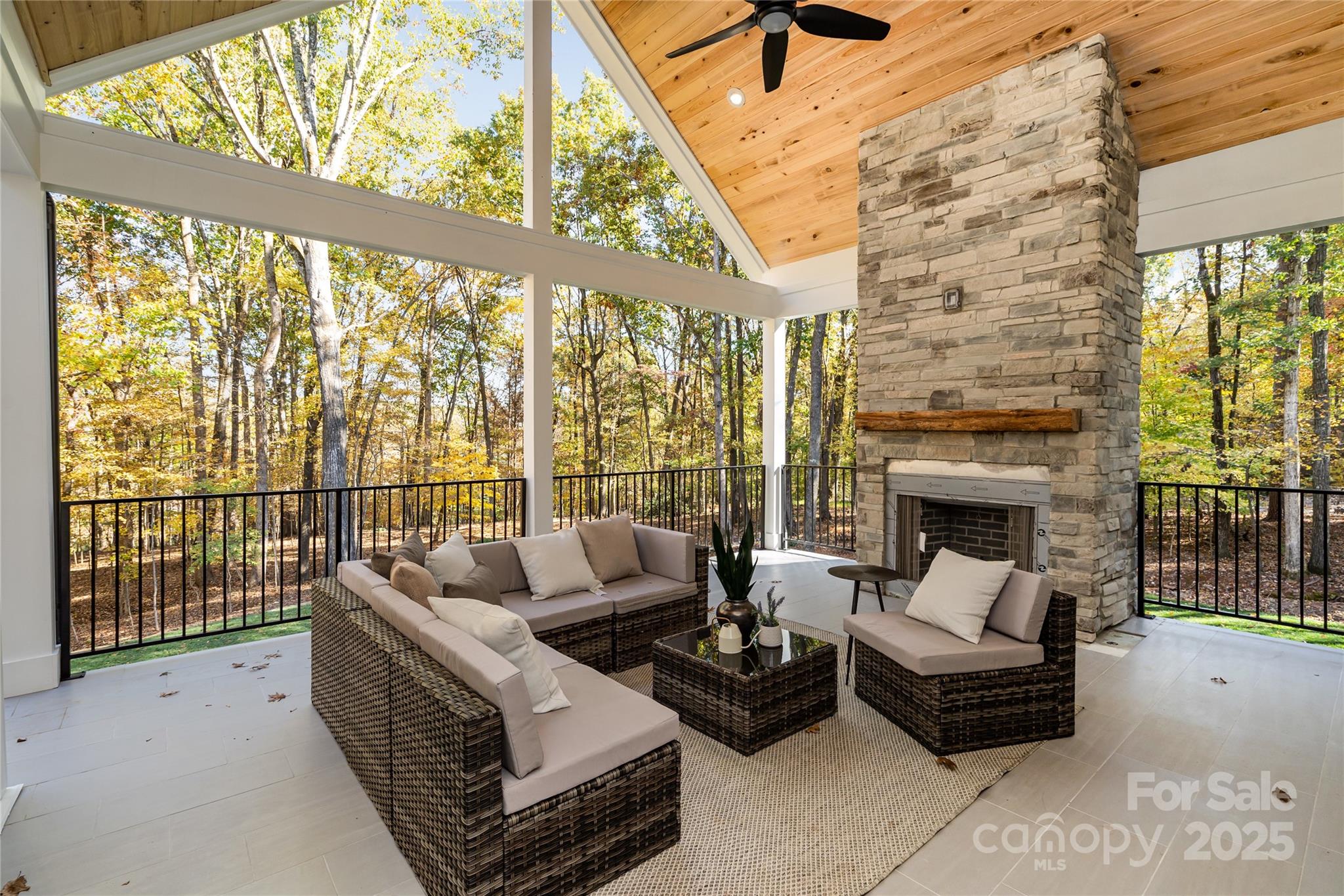 6632 Silver Fox Road Charlotte, NC 28270 - Photo 11 of 42 a living room with furniture and a fireplace