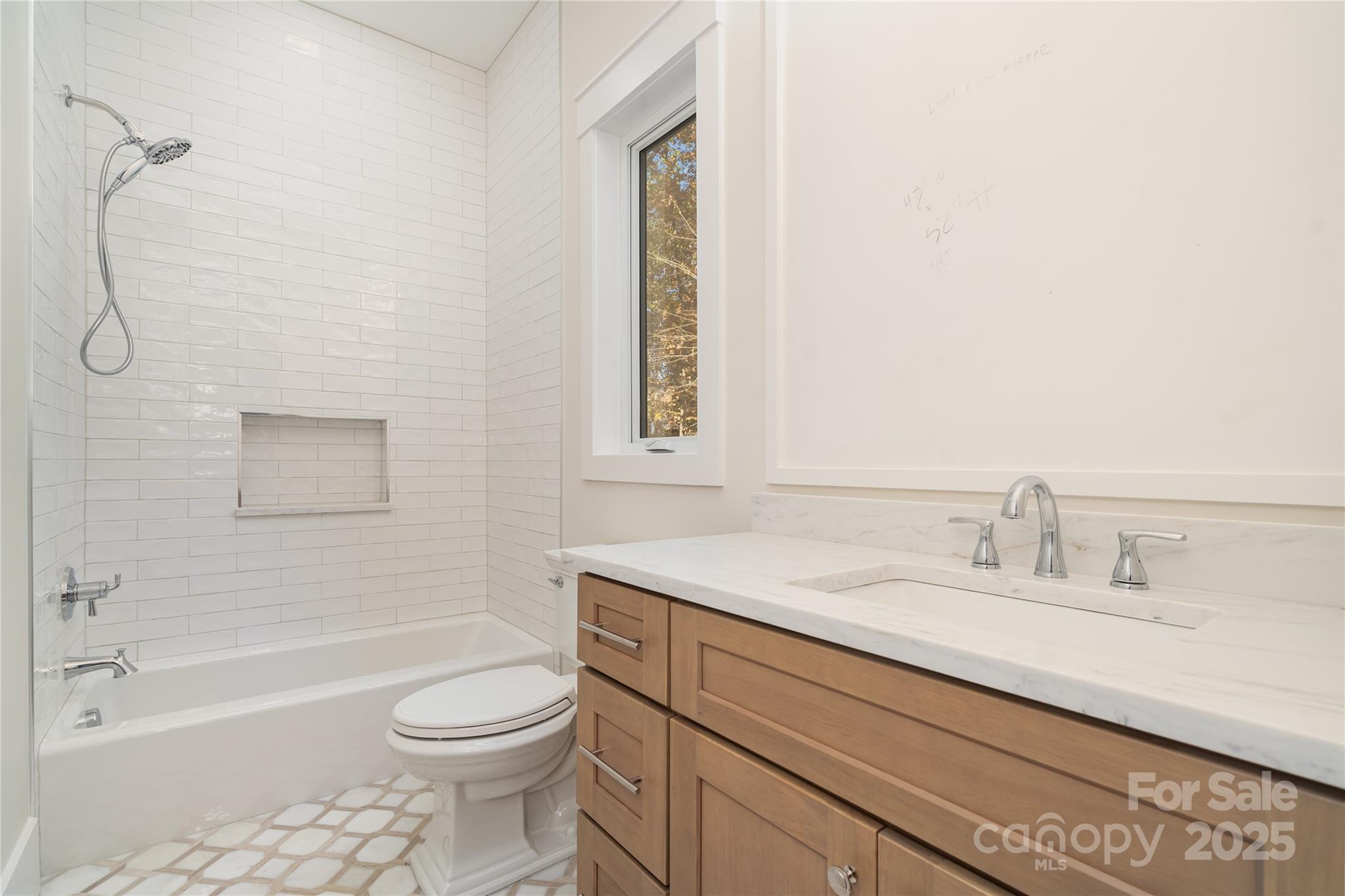 6632 Silver Fox Road Charlotte, NC 28270 - Photo 25 of 42 a bathroom with a sink a toilet and shower