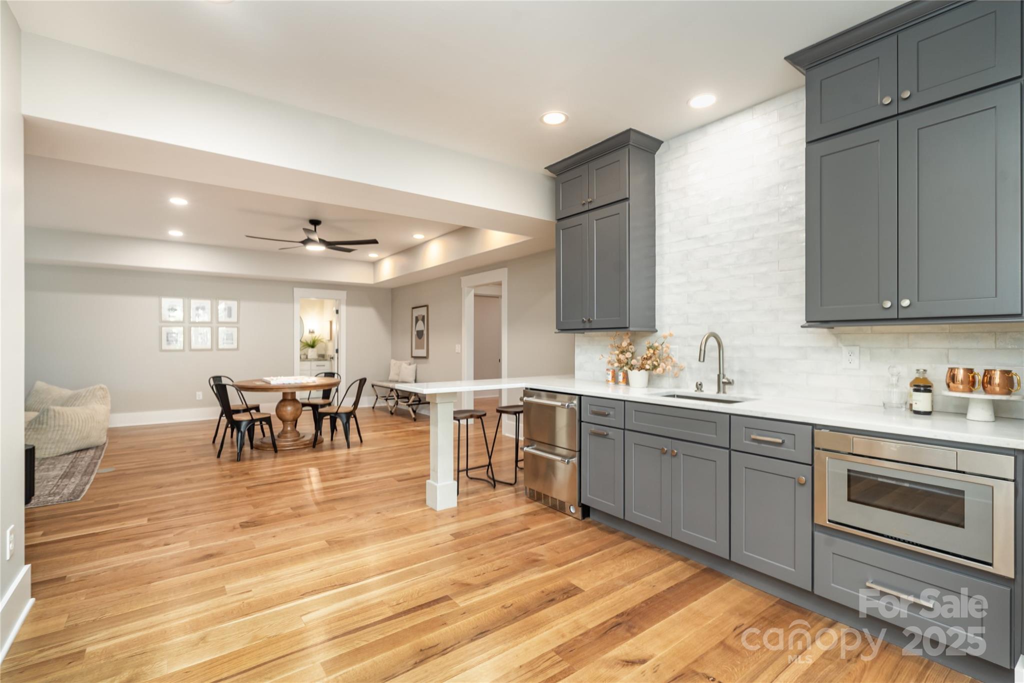 6632 Silver Fox Road Charlotte, NC 28270 - Photo 27 of 42 a kitchen with lots of counter top space and dining table