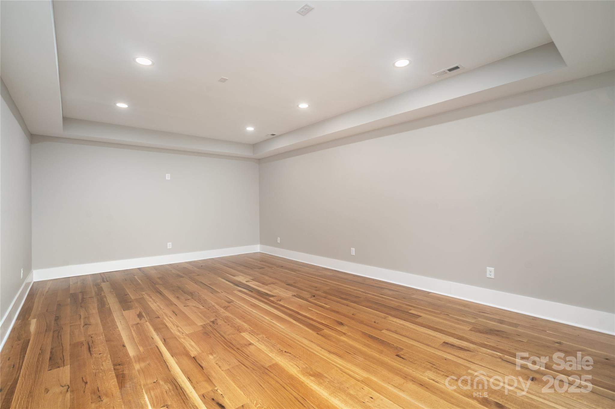 6632 Silver Fox Road Charlotte, NC 28270 - Photo 34 of 42 an empty room with wooden floor and entrance