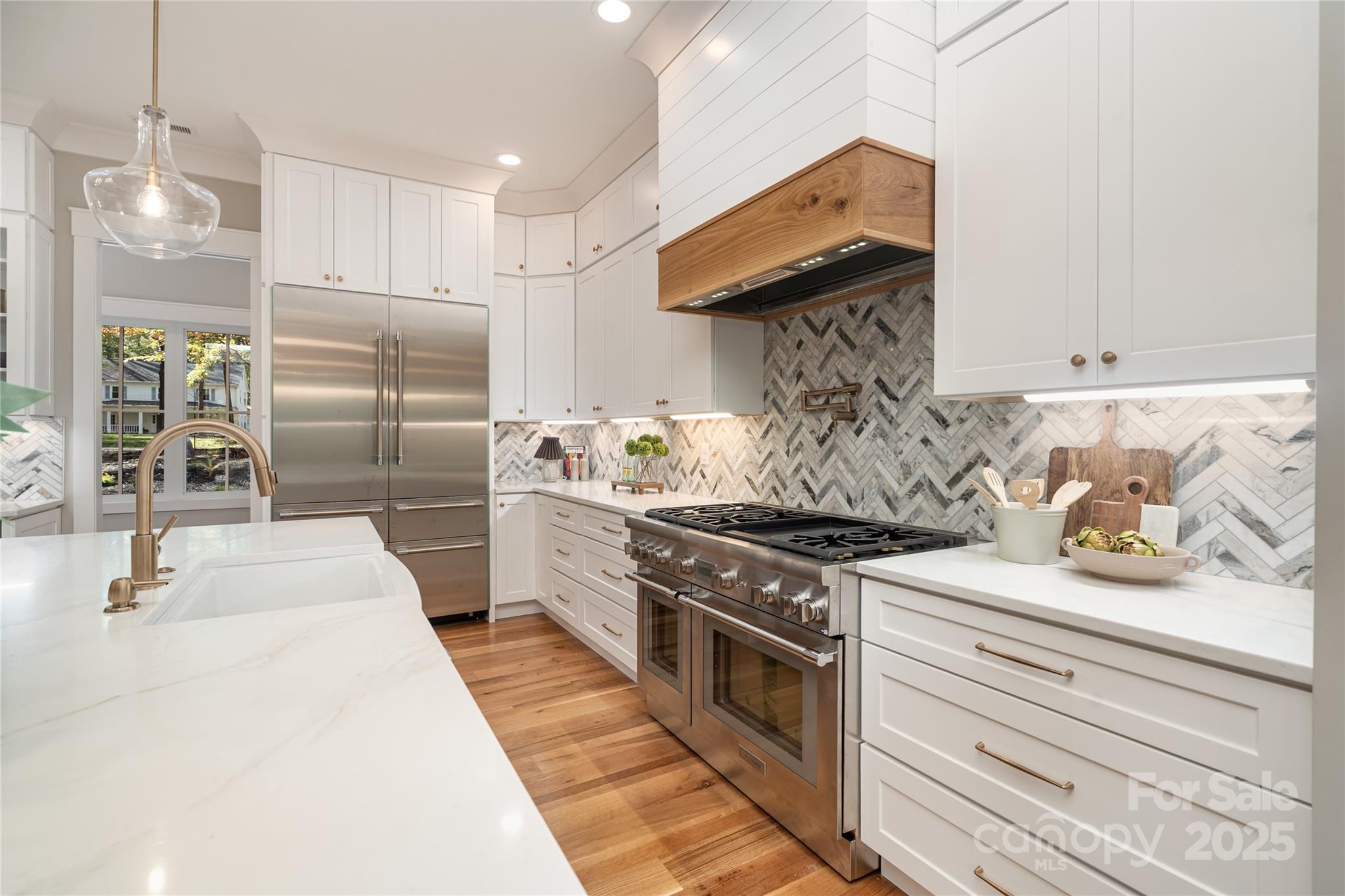 6632 Silver Fox Road Charlotte, NC 28270 - Photo 6 of 42 a kitchen with stainless steel appliances granite countertop a stove and a refrigerator