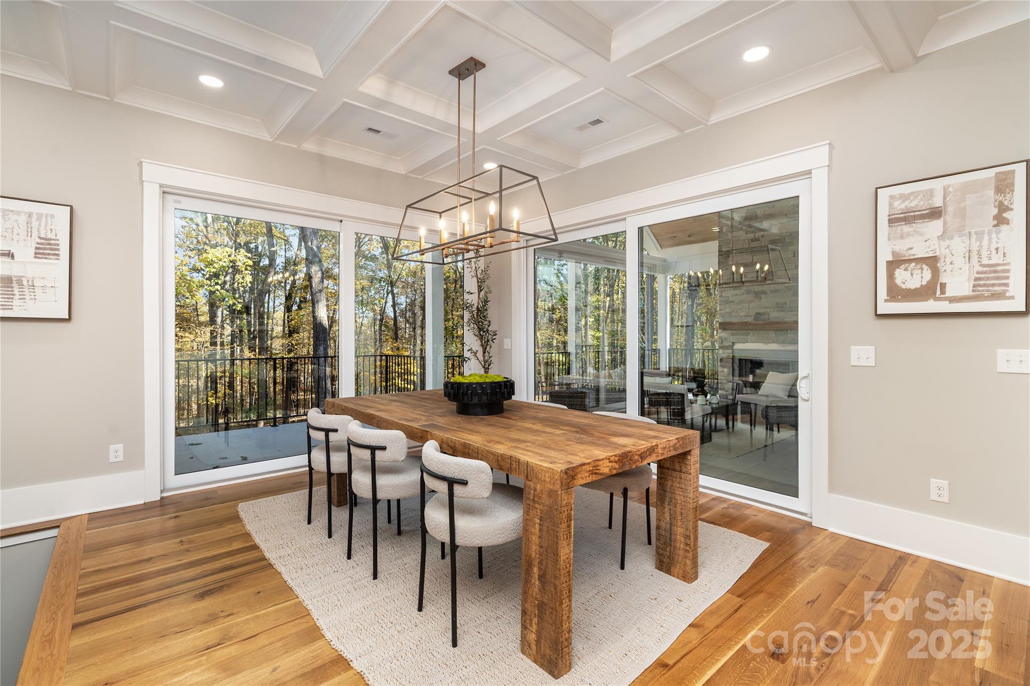 6632 Silver Fox Road Charlotte, NC 28270 - Photo 10 of 42 a view of a dining room with furniture wooden floor and chandelier