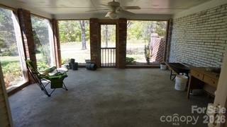 2705 North Center Street, Unit 36 Hickory, NC 28601 - Photo 17 of 21 a living room with furniture and a floor to ceiling window