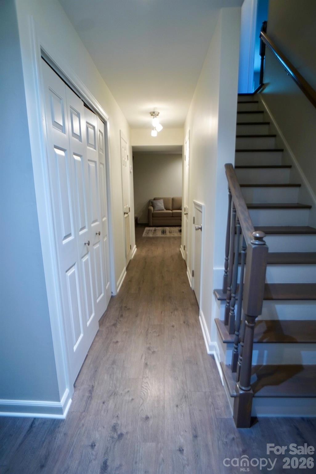 2705 North Center Street, Unit 36 Hickory, NC 28601 - Photo 5 of 21 a view of a hallway with wooden floor and staircase