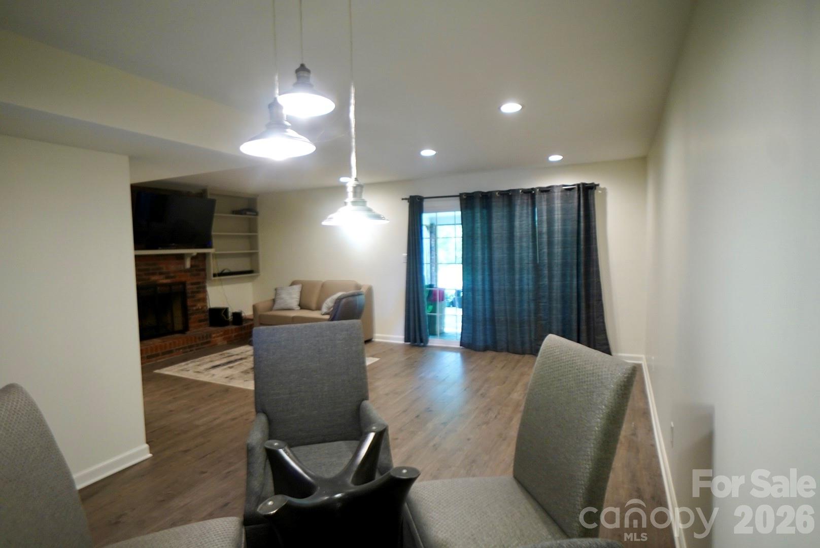 2705 North Center Street, Unit 36 Hickory, NC 28601 - Photo 9 of 21 a view of a livingroom with furniture and a chair