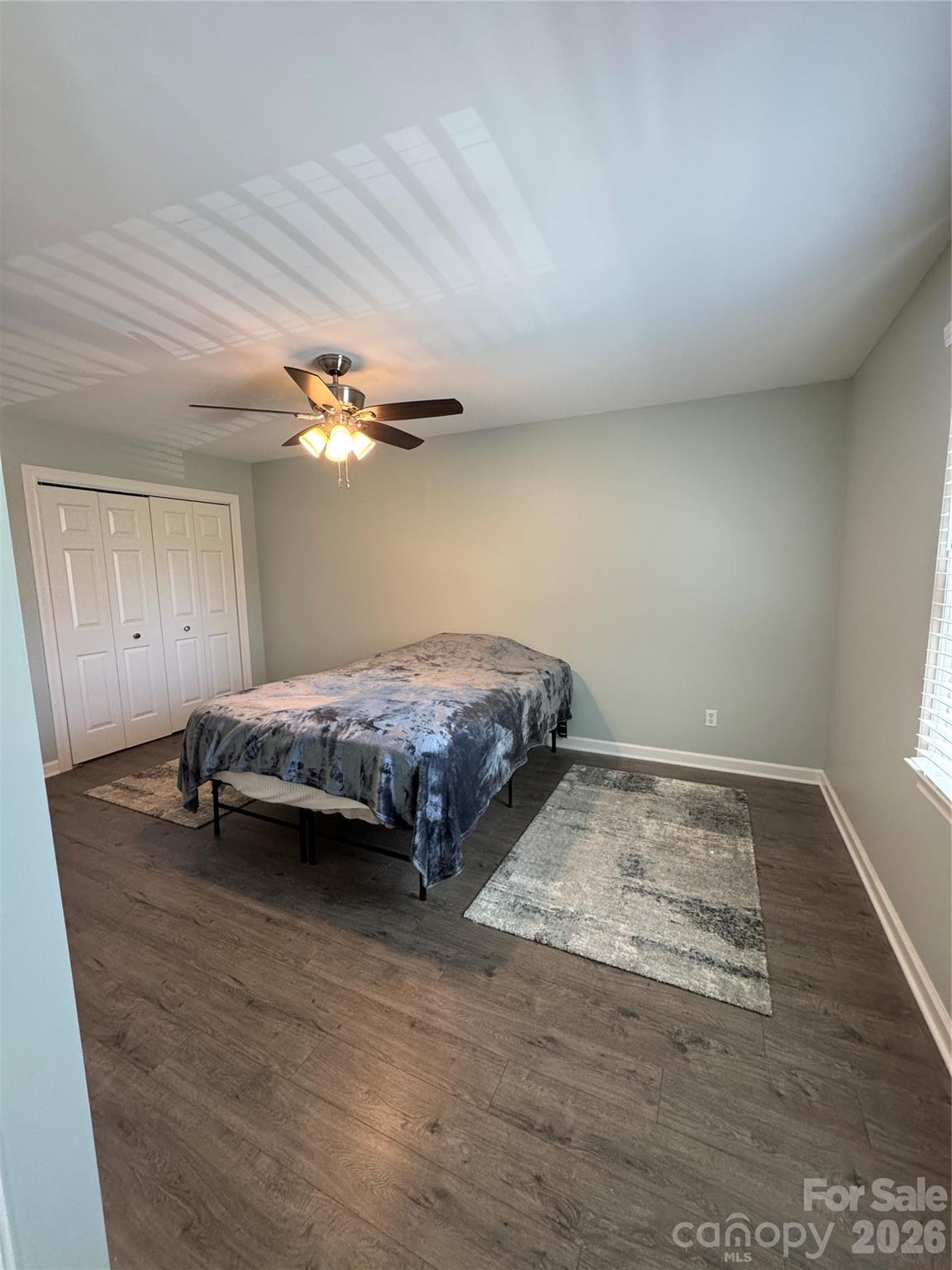 2705 North Center Street, Unit 36 Hickory, NC 28601 - Photo 10 of 21 a bedroom with a bed and a chandelier