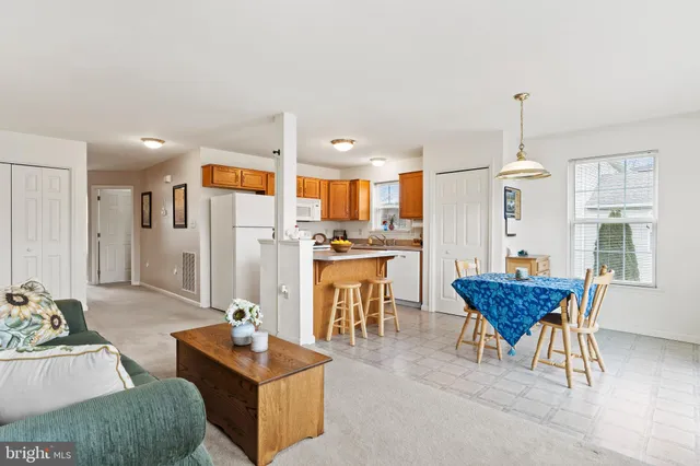 a bathroom with a sink a toilet and a window