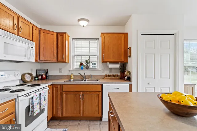a view of walk in closet with clothes