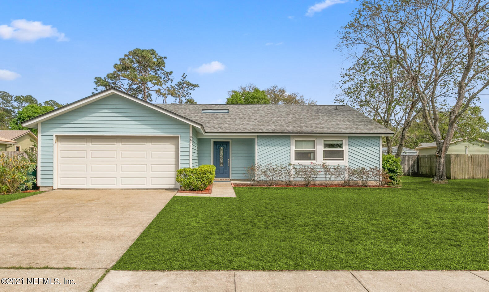 10841 Reading Road Jacksonville, FL 32257 - Photo 1 of 25 a front view of a house with a garden and yard