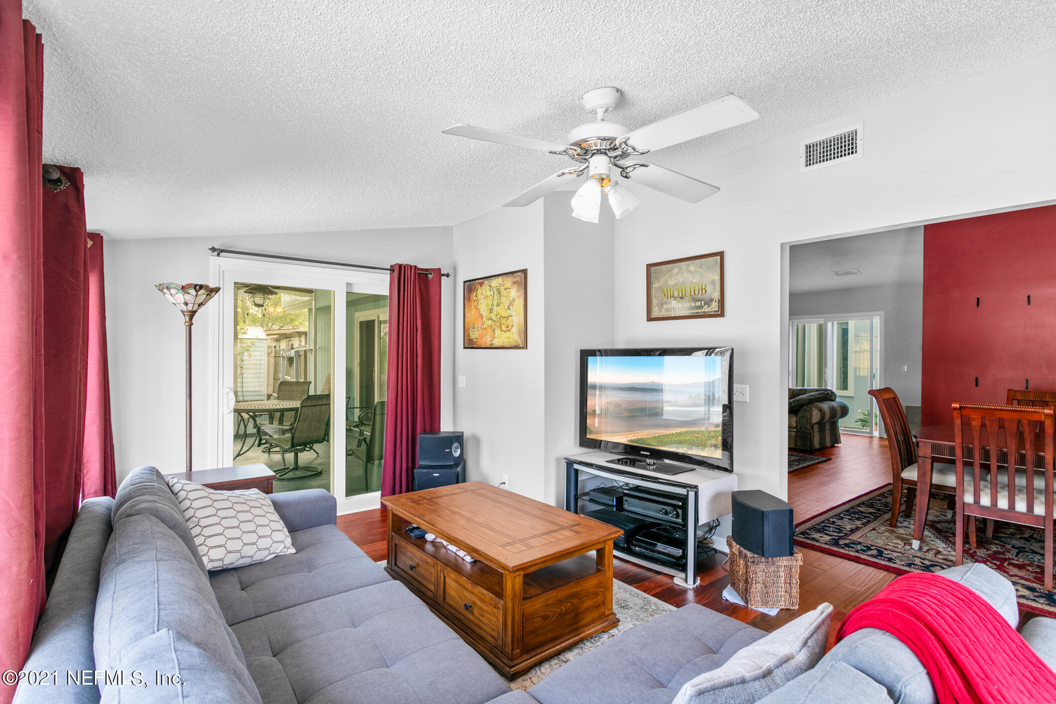 10841 Reading Road Jacksonville, FL 32257 - Photo 11 of 25 a living room with furniture and a flat screen tv