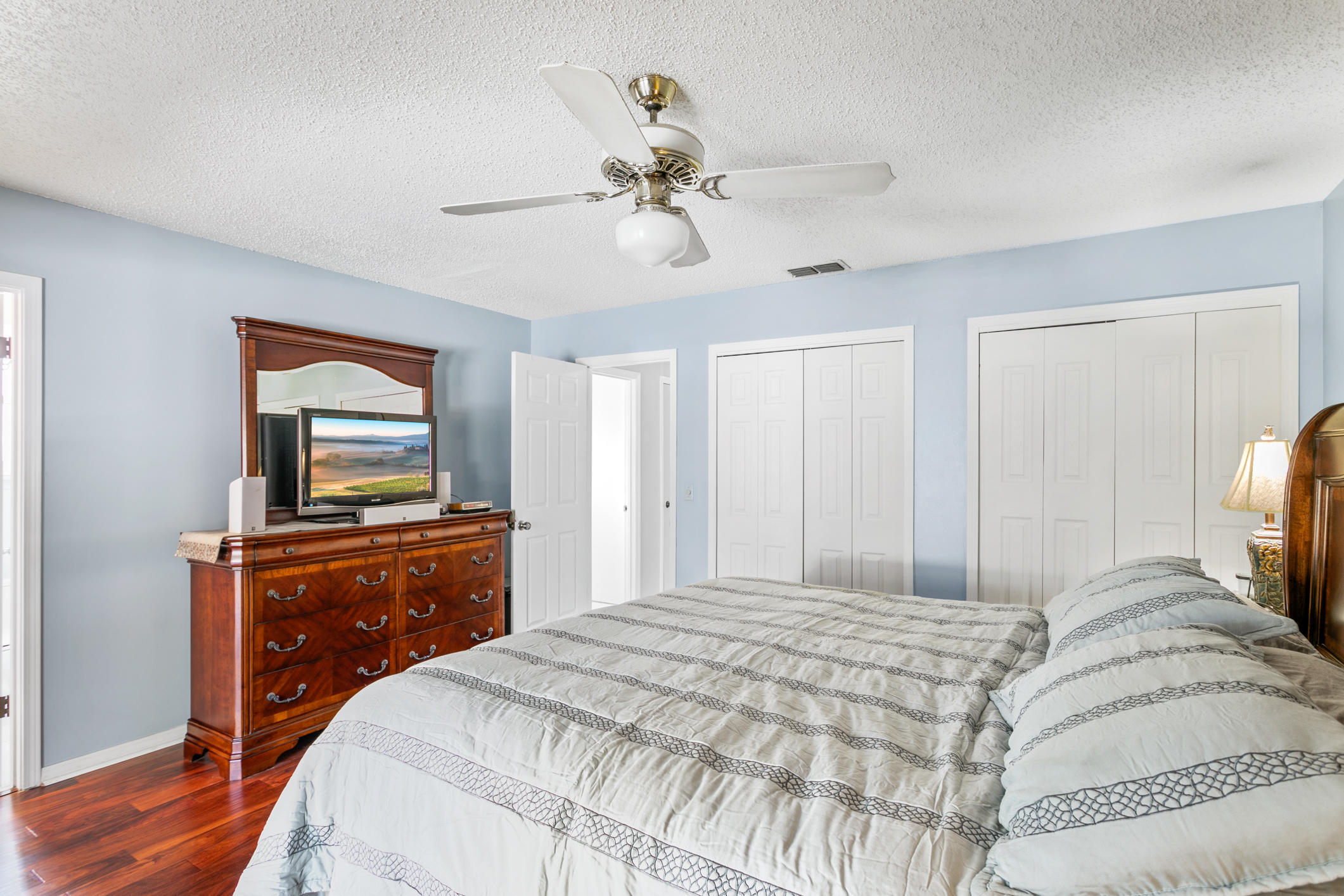 10841 Reading Road Jacksonville, FL 32257 - Photo 14 of 25 a bedroom with a bed and a flat screen tv on a dresser