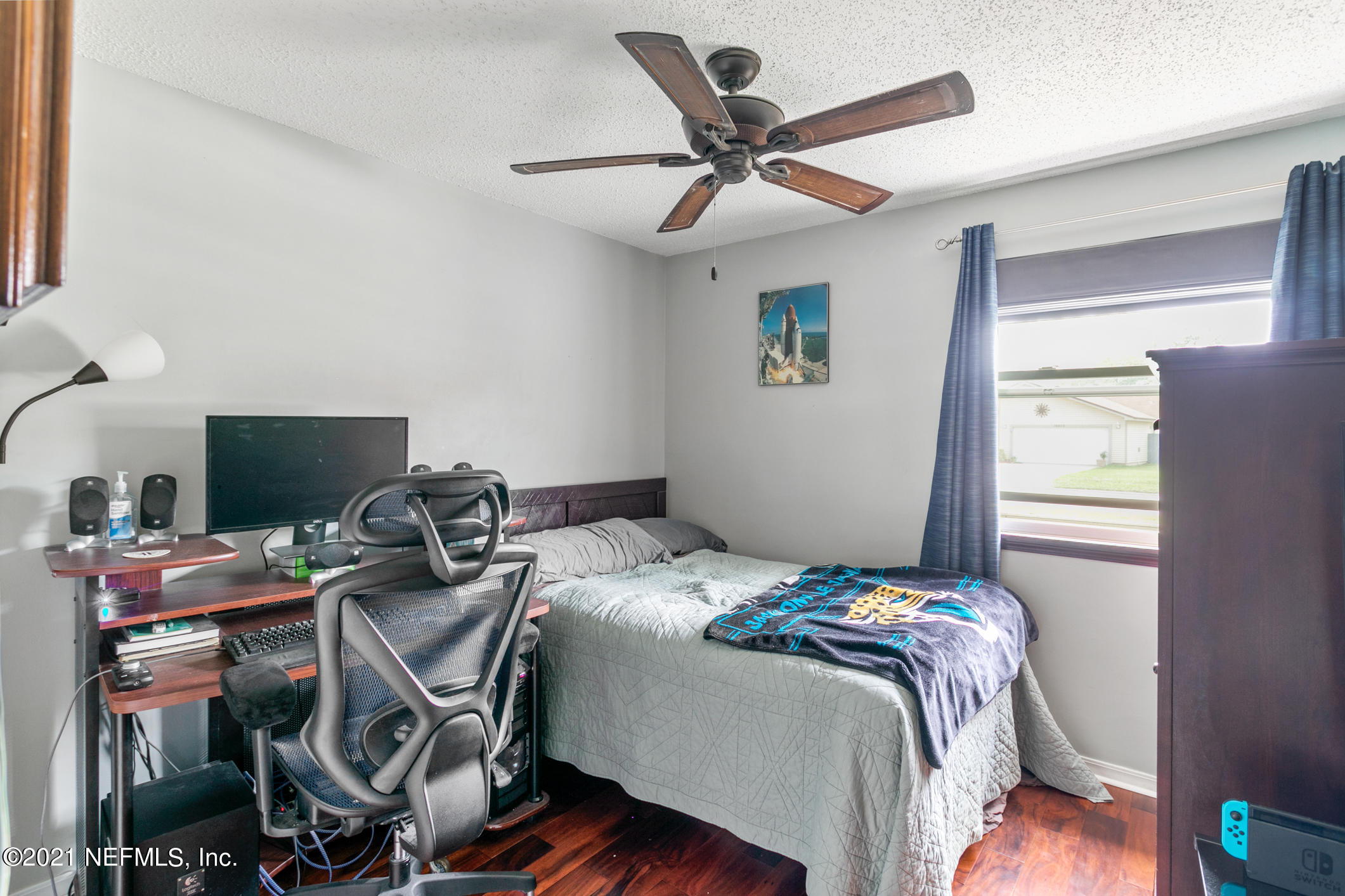 10841 Reading Road Jacksonville, FL 32257 - Photo 17 of 25 a bedroom with a bed and a window