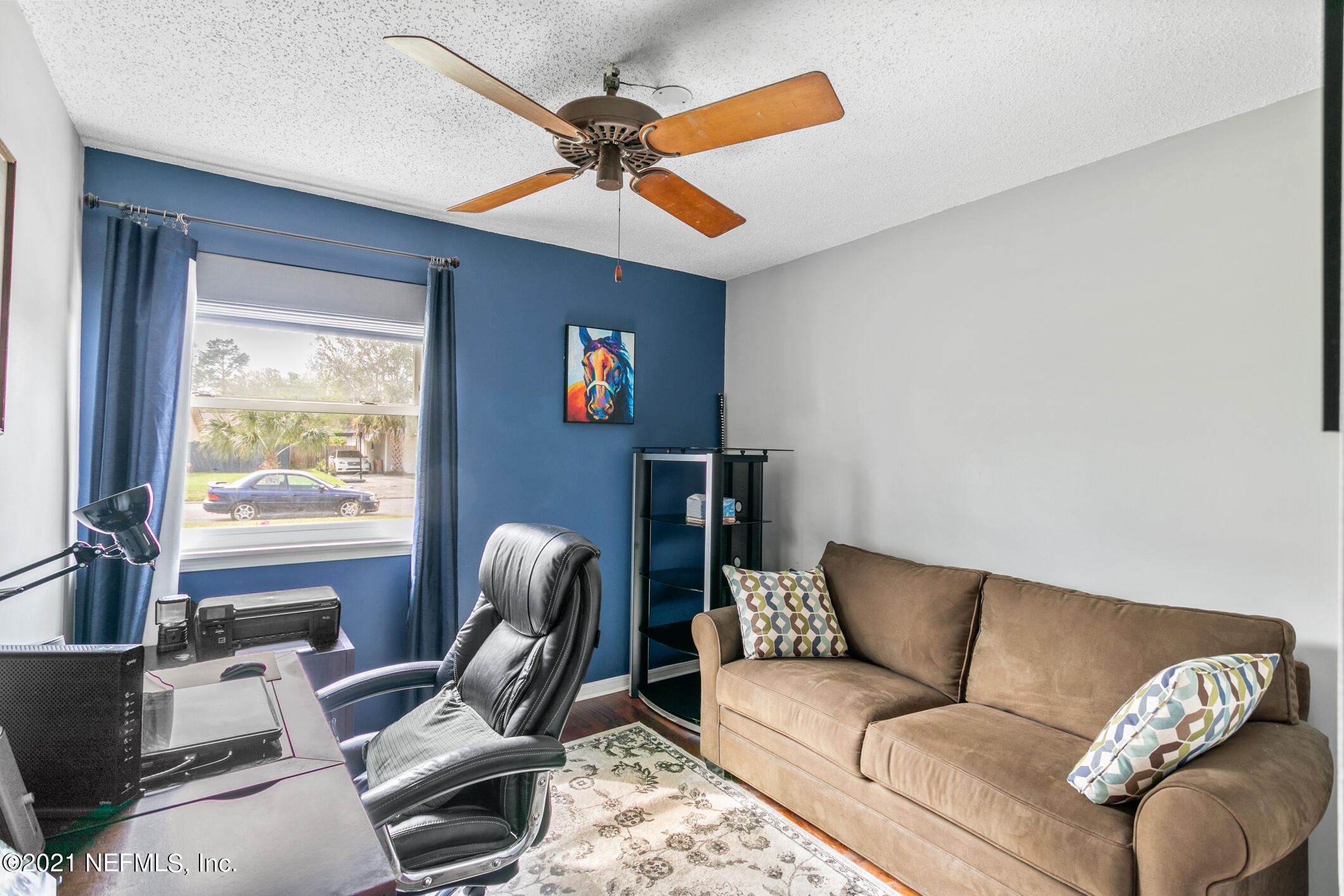 10841 Reading Road Jacksonville, FL 32257 - Photo 18 of 25 a living room with furniture a ceiling fan and a window