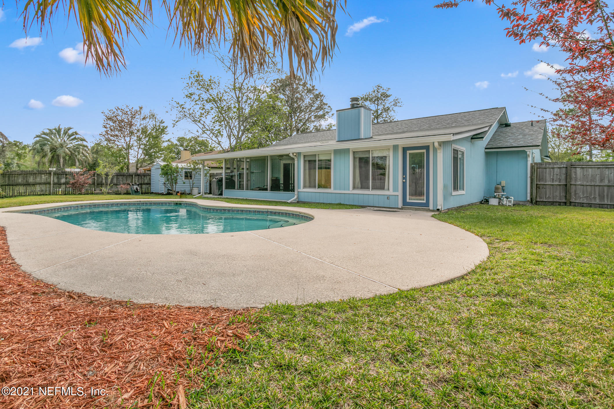 10841 Reading Road Jacksonville, FL 32257 - Photo 22 of 25 a view of a house with a swimming pool and a yard