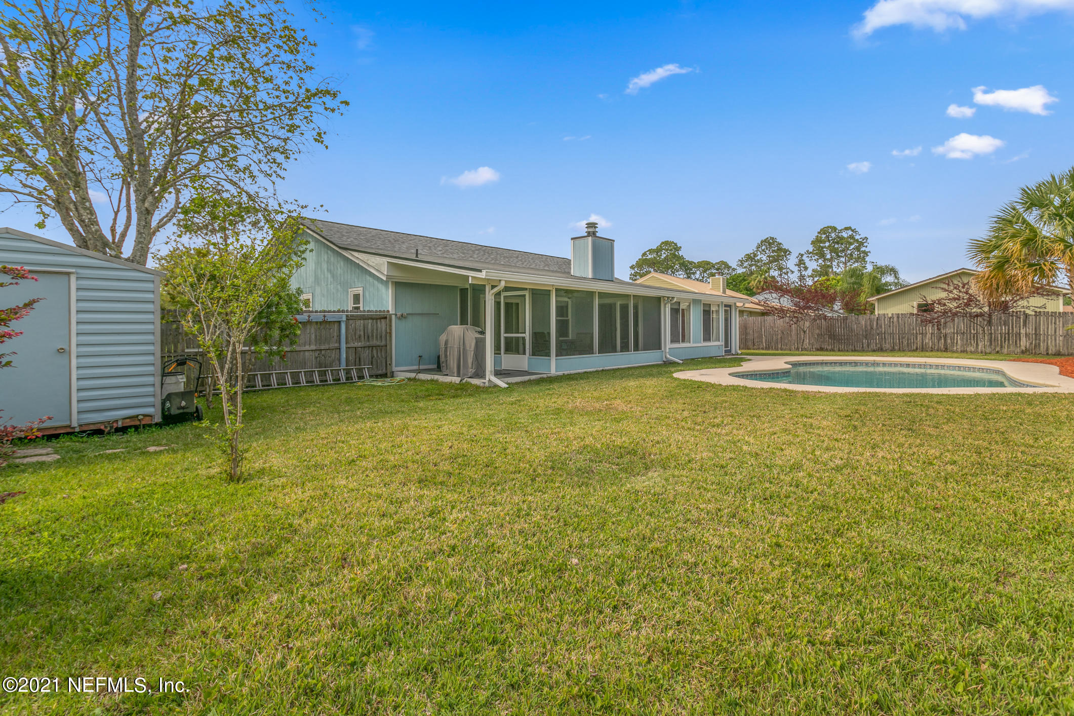 10841 Reading Road Jacksonville, FL 32257 - Photo 24 of 25 a view of a house with swimming pool and porch