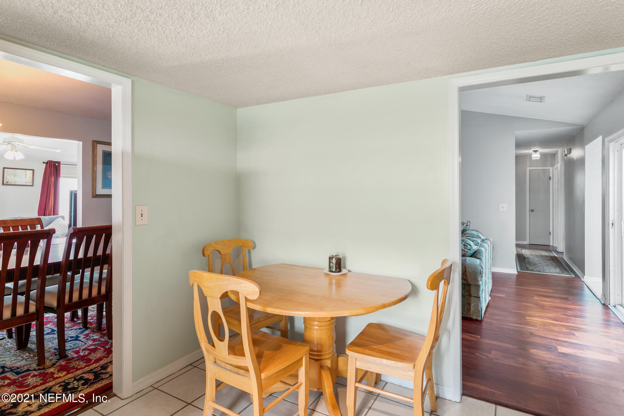 10841 Reading Road Jacksonville, FL 32257 - Photo 6 of 25 a view of a dining room with furniture and wooden floor