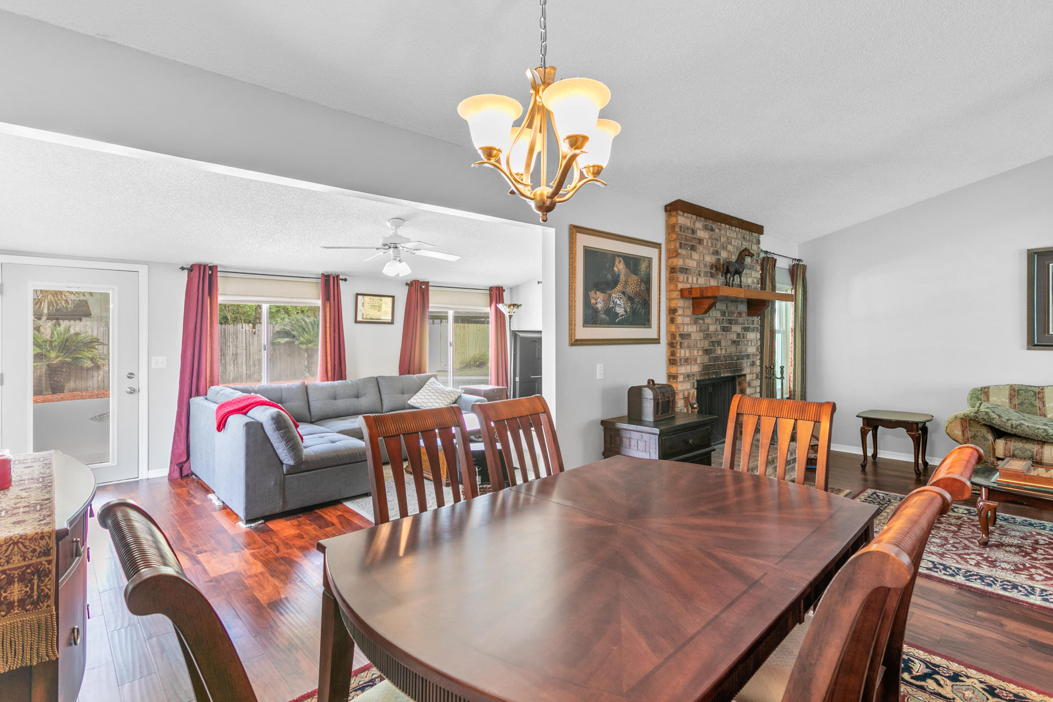 10841 Reading Road Jacksonville, FL 32257 - Photo 7 of 25 a view of a dining room with furniture a chandelier and wooden floor