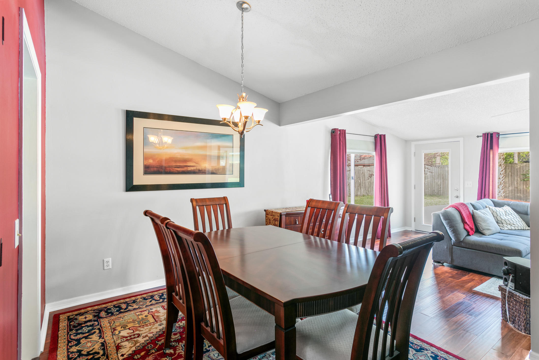 10841 Reading Road Jacksonville, FL 32257 - Photo 8 of 25 a view of a dining room with furniture a chandelier and wooden floor