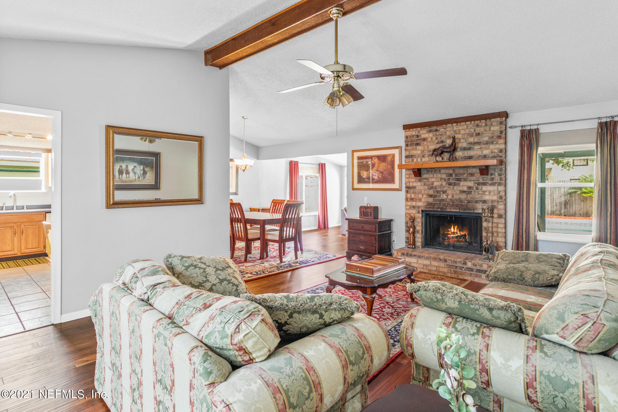 10841 Reading Road Jacksonville, FL 32257 - Photo 10 of 25 a living room with furniture and a fireplace