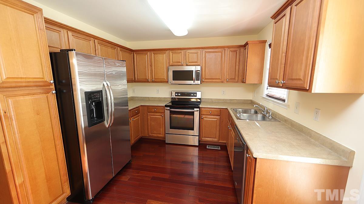 435 Ridge Road Angier, NC 27501 - Photo 19 of 29 Features stainless steel appliances including refrigerator. Stove and microwave are LG.