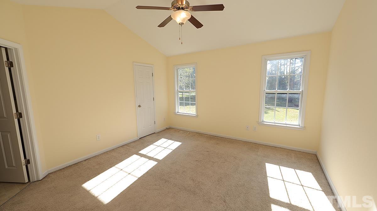 435 Ridge Road Angier, NC 27501 - Photo 23 of 29 Cathedral ceiling and walk-in closet is spacious master bedroom. Master bath features garden tub, separate shower, double vanity and separate water closet.