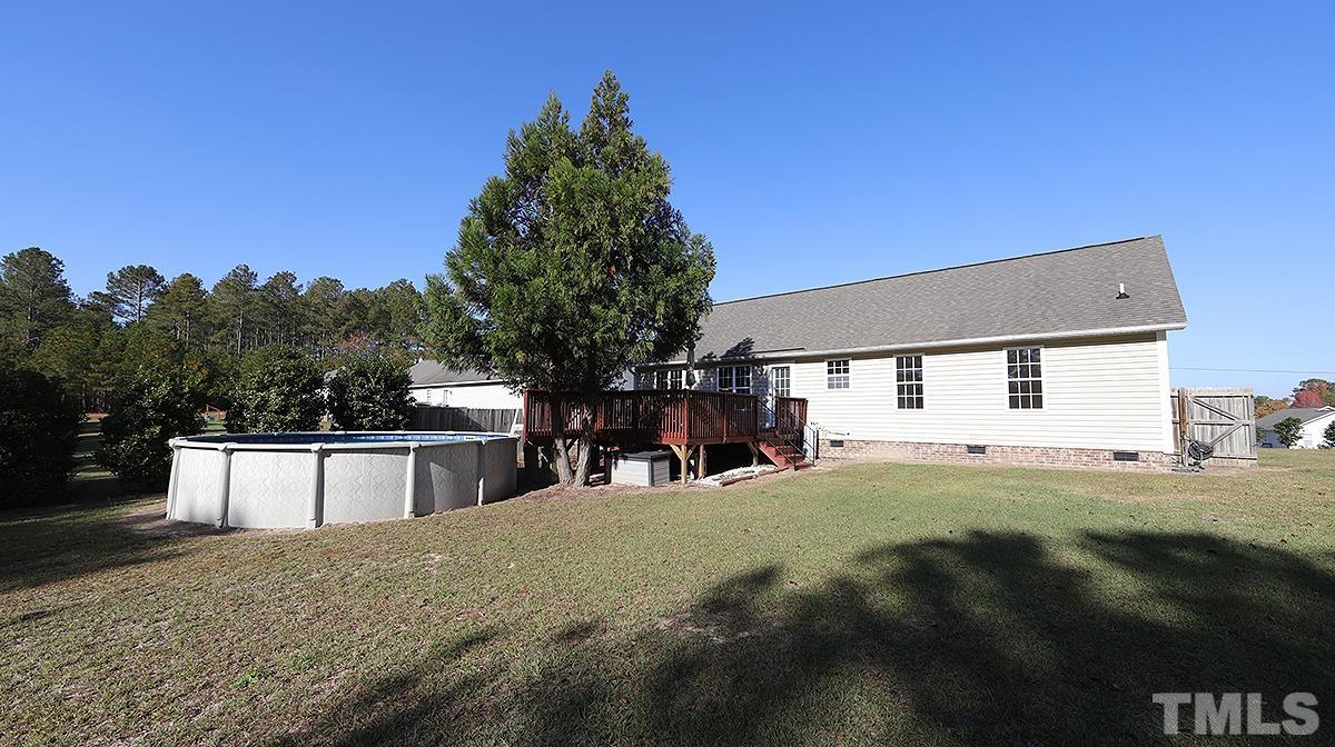 435 Ridge Road Angier, NC 27501 - Photo 4 of 29 Large level backyard with above ground pool, oversized deck and outbuilding.